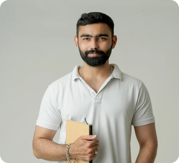 young_indian_man_standing_with_note_book_isolated_white